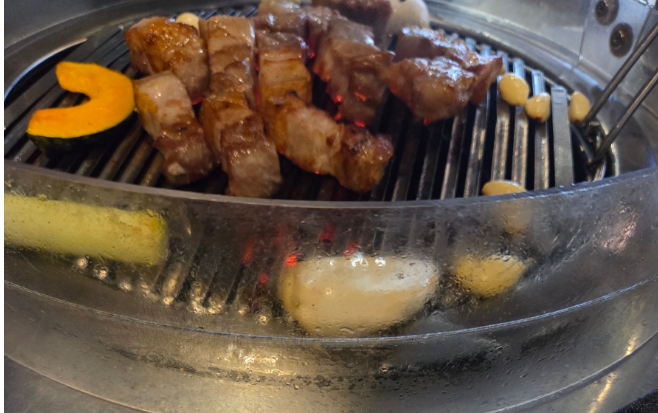 Korean pork belly or pork belly is being grilled deliciously on a grill(samgyeopsal and ogyeopsal.)