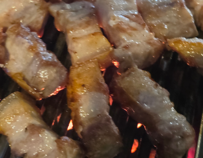 Korean pork belly or pork belly is being grilled deliciously on a grill(samgyeopsal and ogyeopsal.)