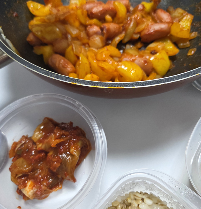 Korean sausage stir-fry served with a bowl of steamed rice