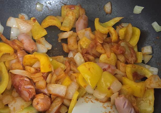 Finished Korean sausage stir-fry garnished with sesame seeds